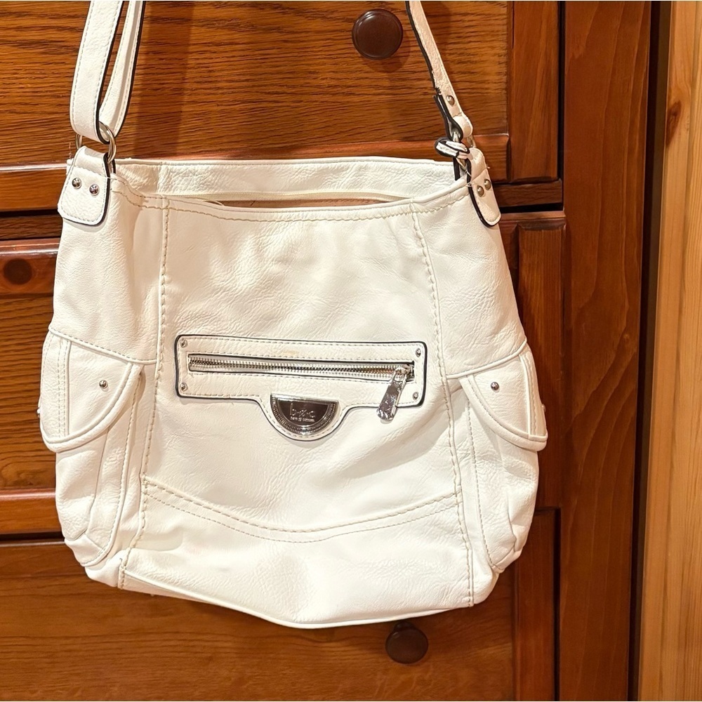 B.O.C white faux leather W/matching stitching, black trim, and silver hardware